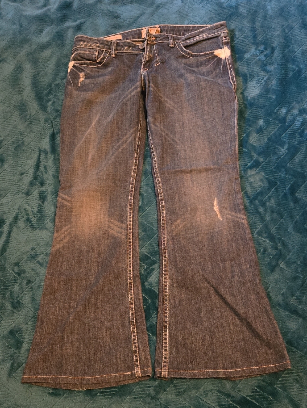 Women’s Dark Blue Flare Jeans with Subtle Distressing